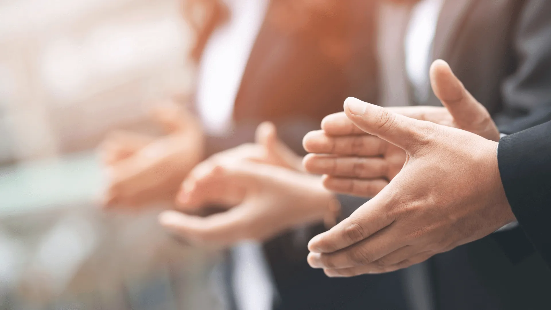 People applauding at a business event